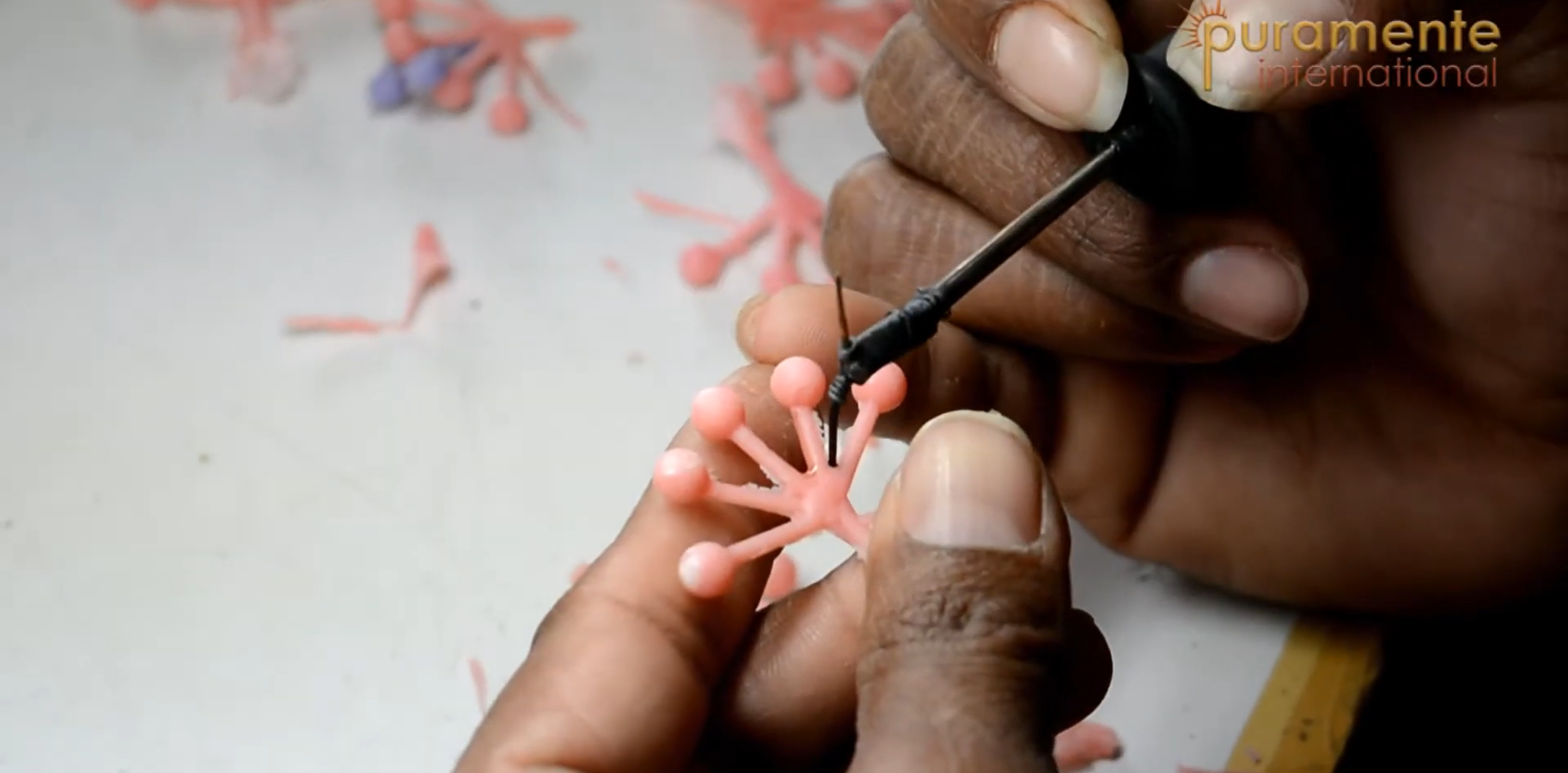 Hands working on jewelry